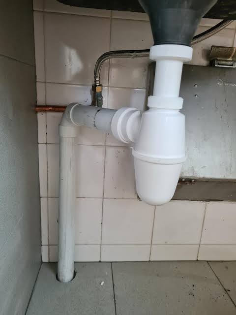 Bottle Trap & Outlet Piping Replacement